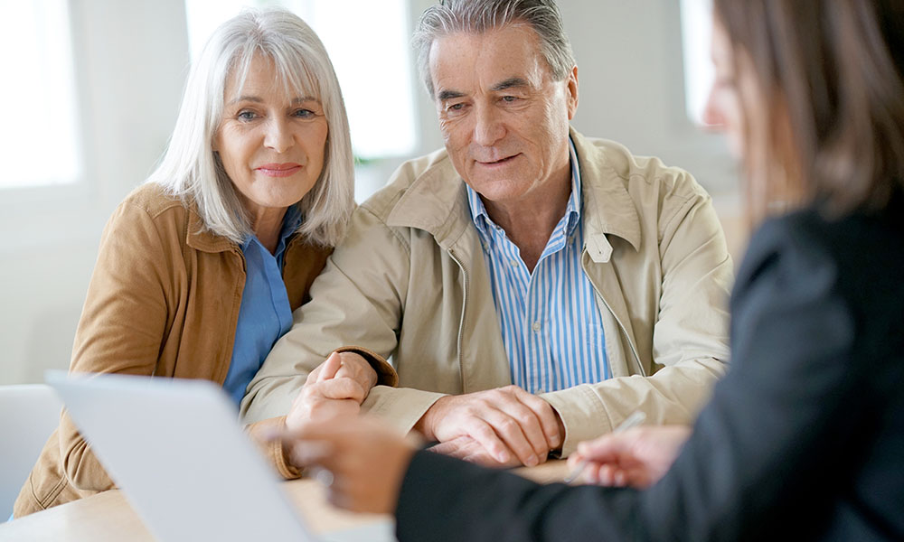 An elderly couple working on their retirement planning